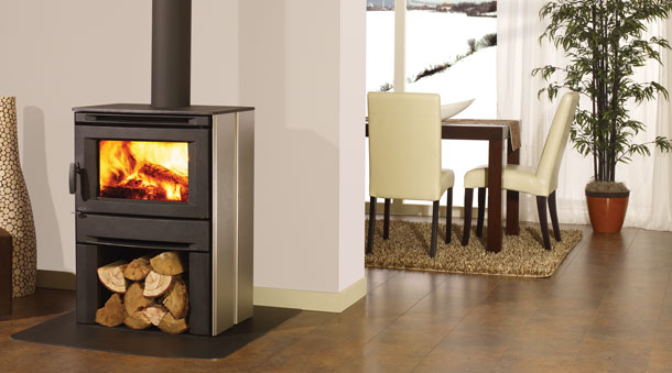Regency Alterra Wood Stove with wood table and white chairs in the background