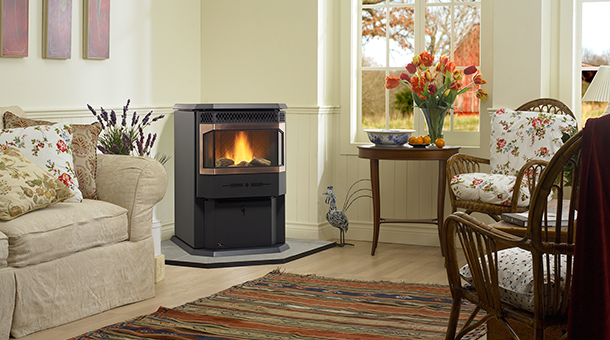 Regency Greenfire GF55 Medium Pellet Stove with sofa to the left and table and chairs to the right
